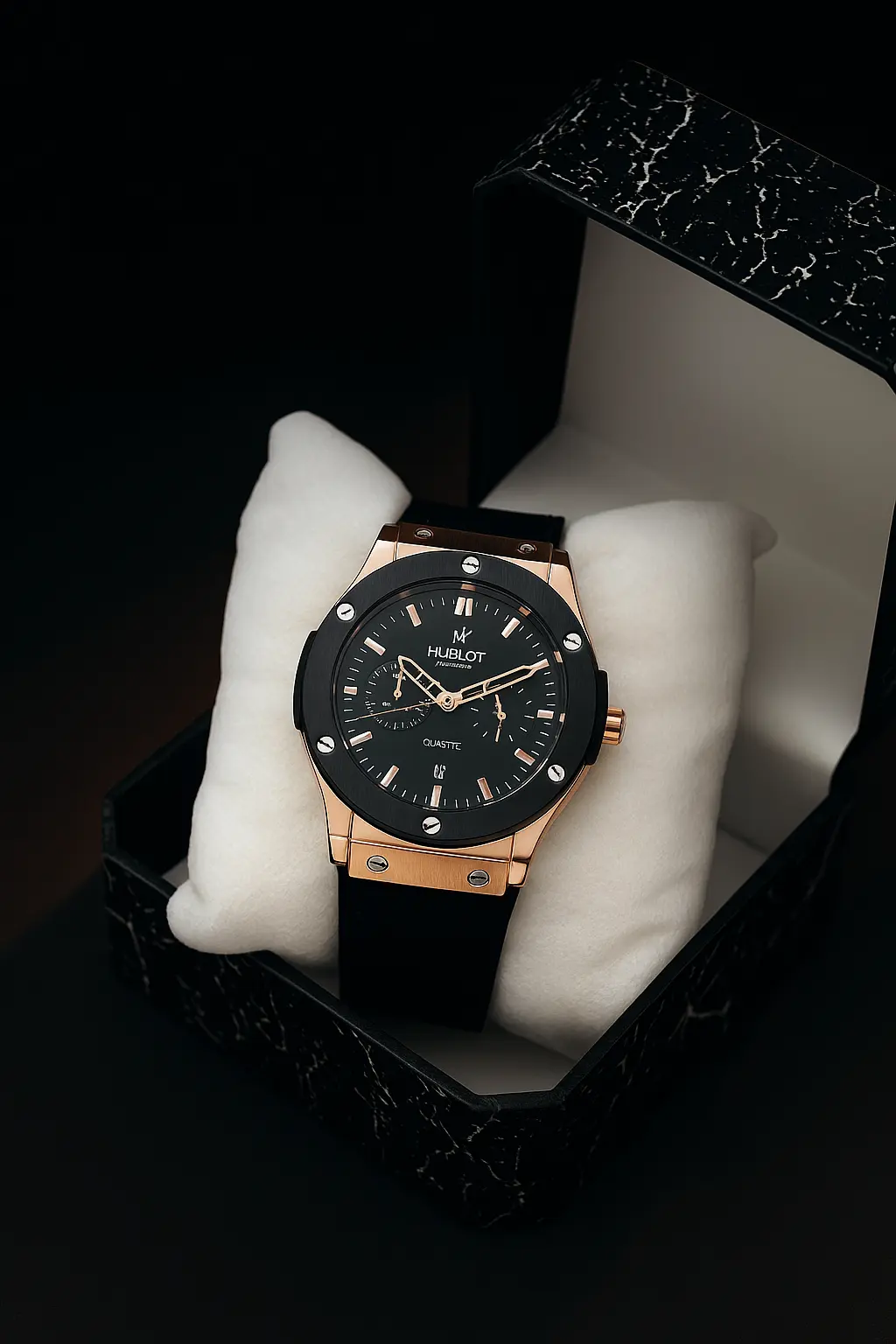 Hublot black and rose gold quartz watch with black dial, automatic movement, and black rubber strap for men.