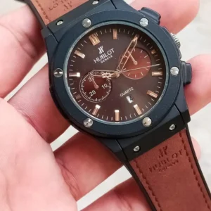 Hublot brown leather quartz chronograph watch with black and brown design, date display, and sleek finish for men.