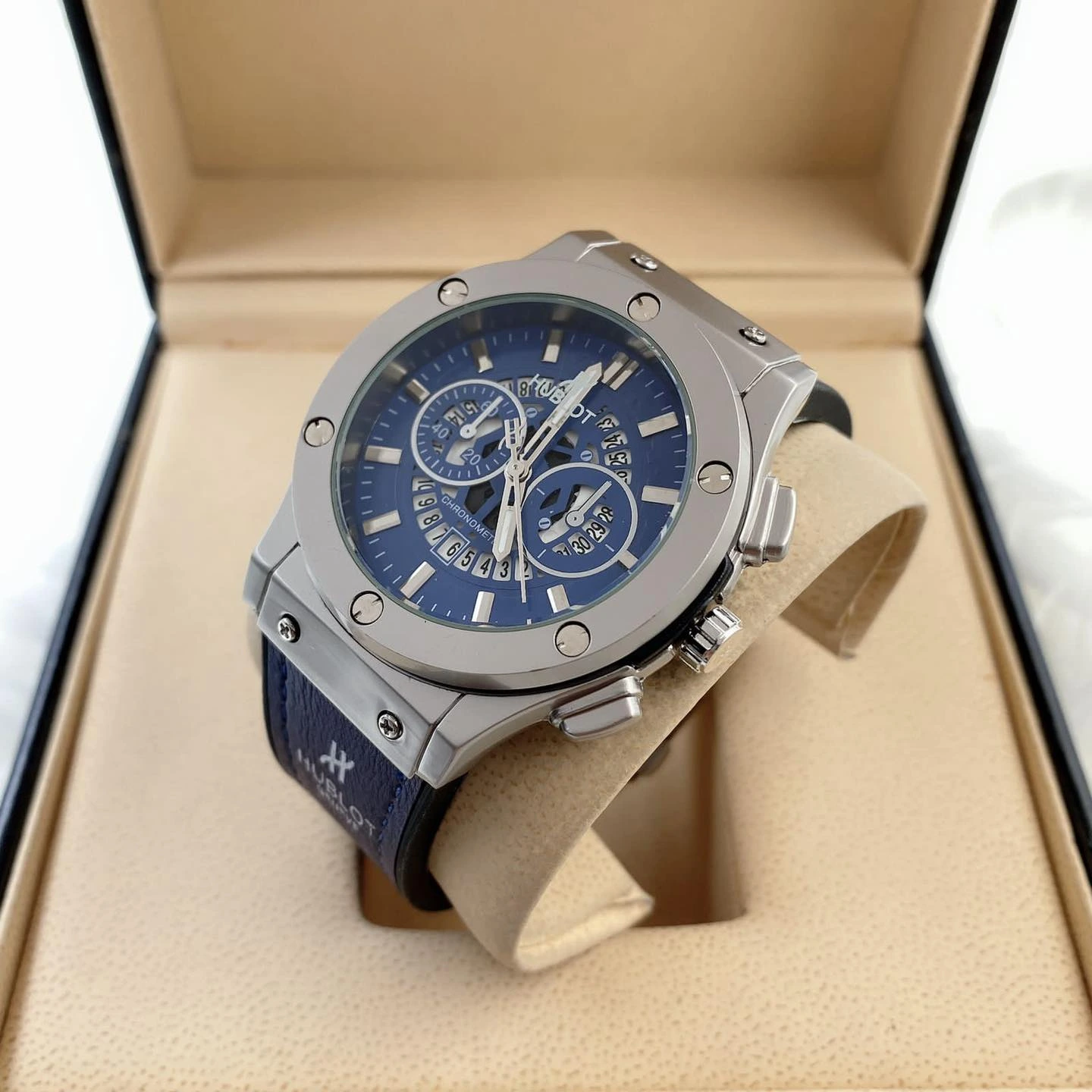 Hublot Chronograph Blue Dial Luxury Watch with stainless steel case and leather strap, sporty and elegant design for men.