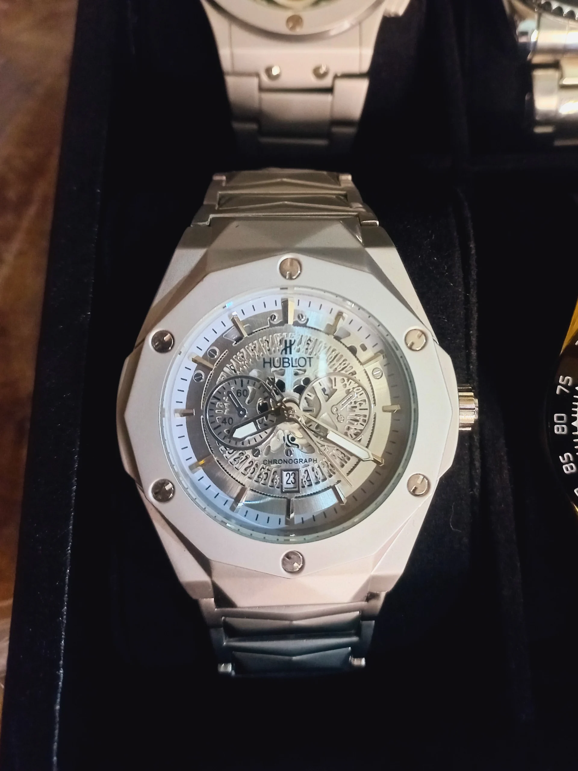 Hublot white chronograph watch with ceramic and stainless steel band, luxury sporty timepiece for men.