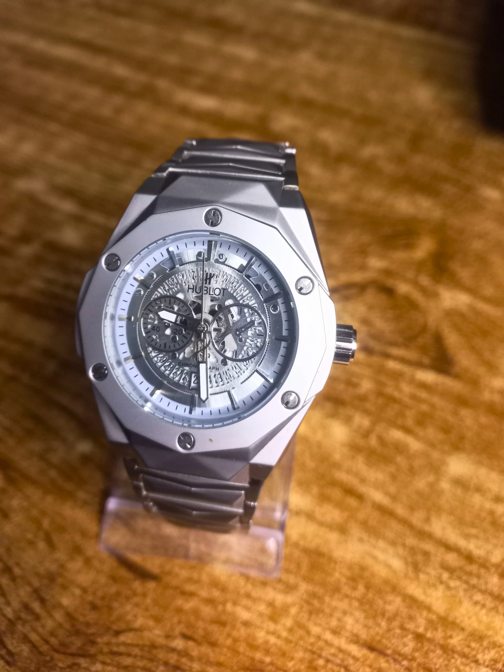 Hublot white chronograph watch with ceramic and stainless steel band, luxury sporty timepiece for men.